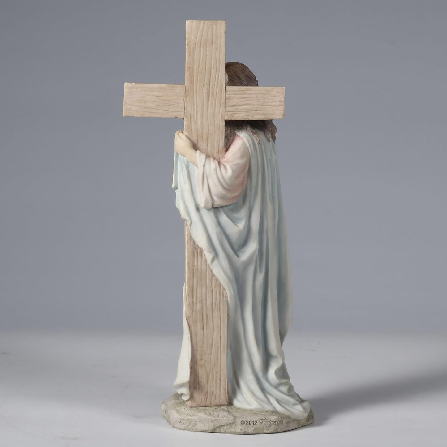 11.25" Jesus with Sacred Heart Leaning on The Dove Cross Figurine