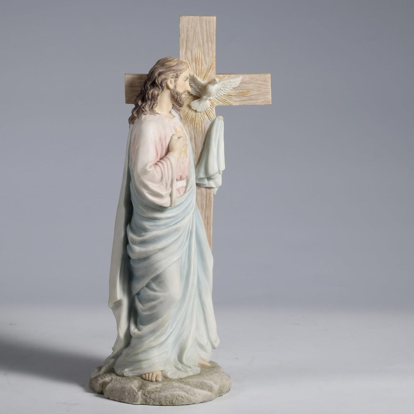 11.25" Jesus with Sacred Heart Leaning on The Dove Cross Figurine